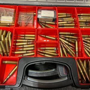 A rare collection of 7.62 x51mm Early NATO Ammunition arranged in a collector case for display and recognition.